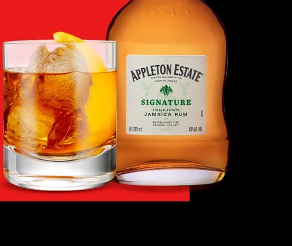 Appleton Estate Signature Jamaica Rum bottle with rocks glass